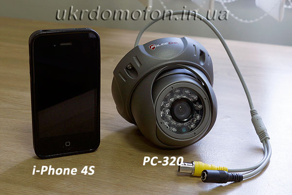 размеры уличной камеры наблюдения PoliceCam PC320 в сравнении с i-Phone 4s